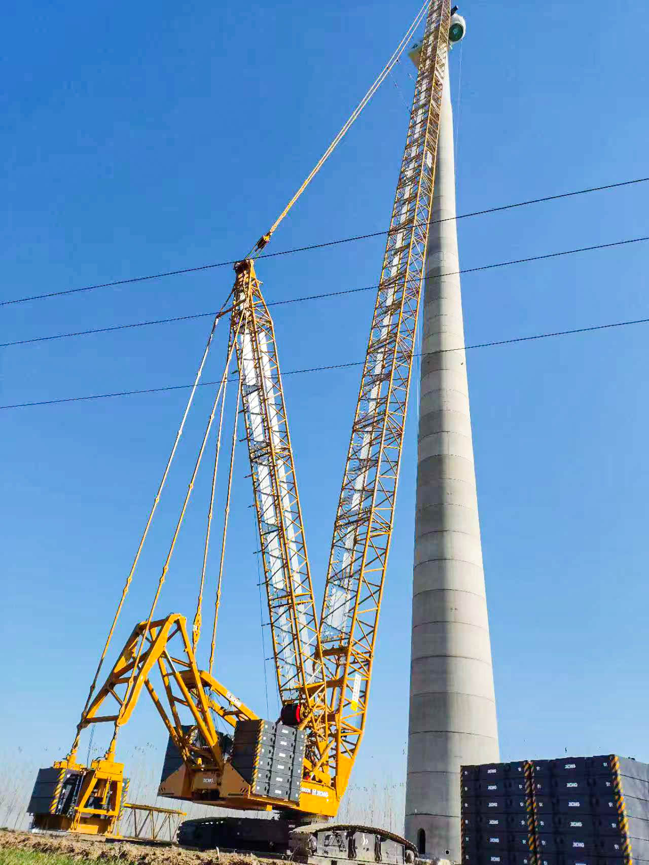 160米高空精准“搭积木”：九游娱乐XLC15000M分体吊装6.25兆瓦风机全纪录